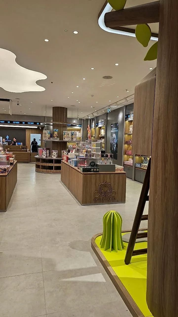 The same cloud ceiling light over display tables at the Pop Mart store MO Team fitted out at the Trafford Centre